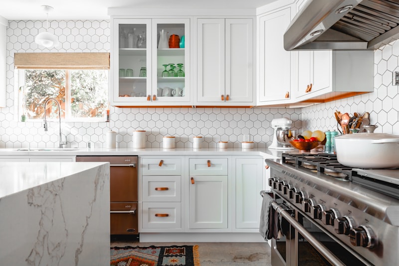 A sleek minimalist cabinet pull elegantly outfits modern kitchen cabinetry by HomeTouch