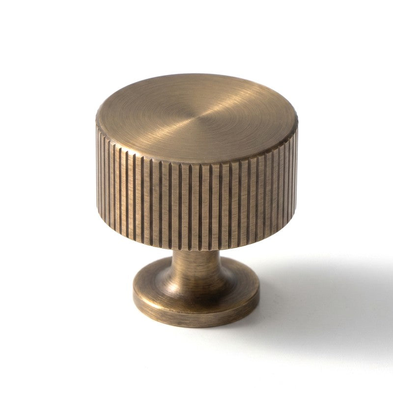 This Hometouch cabinet pull features a warm metallic brass finish and a clean rectangular shape, designed for contemporary kitchen cabinetry and furniture hardware applications.