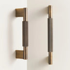 A brass door pull with a cross-shaped knurled handle, designed for cabinet or furniture use, is presented in a product photography style suitable for hardware catalogs or e-commerce on Hometouchware.com.