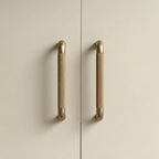 A rectangular cabinet pull in a brass gold finish, designed for furniture hardware with a clean bar shape suitable for modern cabinetry and available from Hometouch.