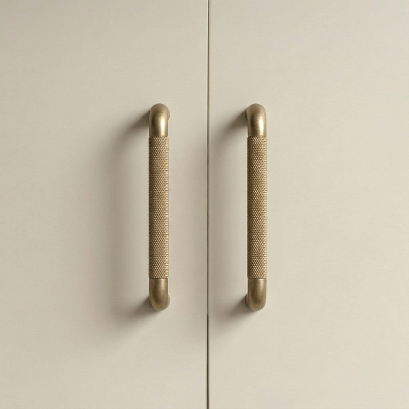 A rectangular cabinet pull in a brass gold finish, designed for furniture hardware with a clean bar shape suitable for modern cabinetry and available from Hometouch.