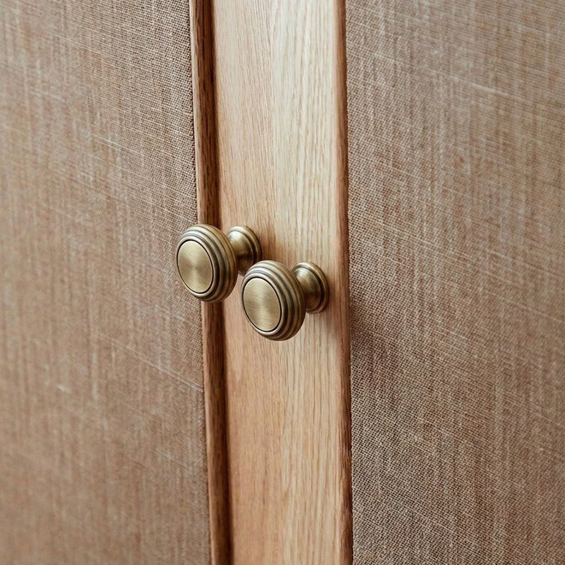 A rectangular cabinet pull in brass gold finish from Hometouch, designed for modern furniture and cabinetry hardware applications.