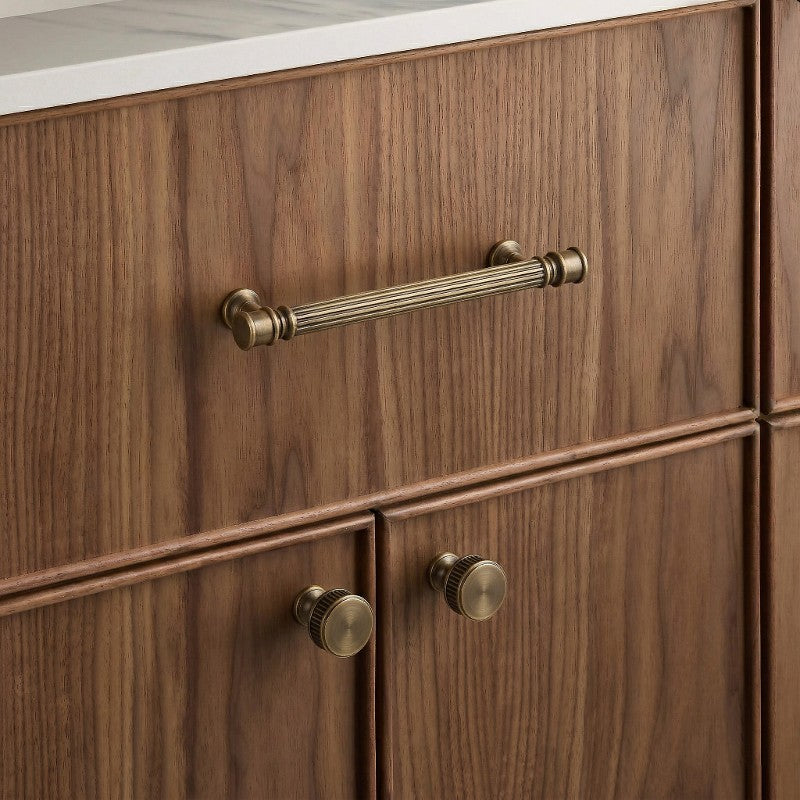 A rectangular brass cabinet pull in a gold finish, shown in a clean product photography style suitable for hardware catalogs or interior design applications.