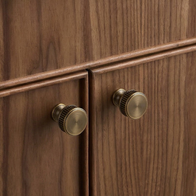 Brass rectangular cabinet knobs by Hometouch, installed on warm walnut wood doors, embodying modern minimalist and Japandi aesthetic with clean lines and textured finish.