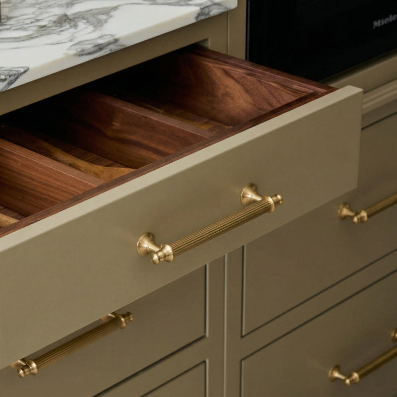 A rectangular brass cabinet pull in a gold finish, designed for cabinetry and furniture, with product details available at www.hometouchware.com.