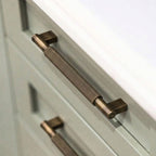 A Hometouch handle in polished brass gold features a round knob shape designed for cabinet pulls, with product details available at www.hometouchware.com.