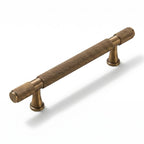 A Hometouch round brass cabinet pull with a gold finish designed for contemporary furniture and cabinetry hardware applications.