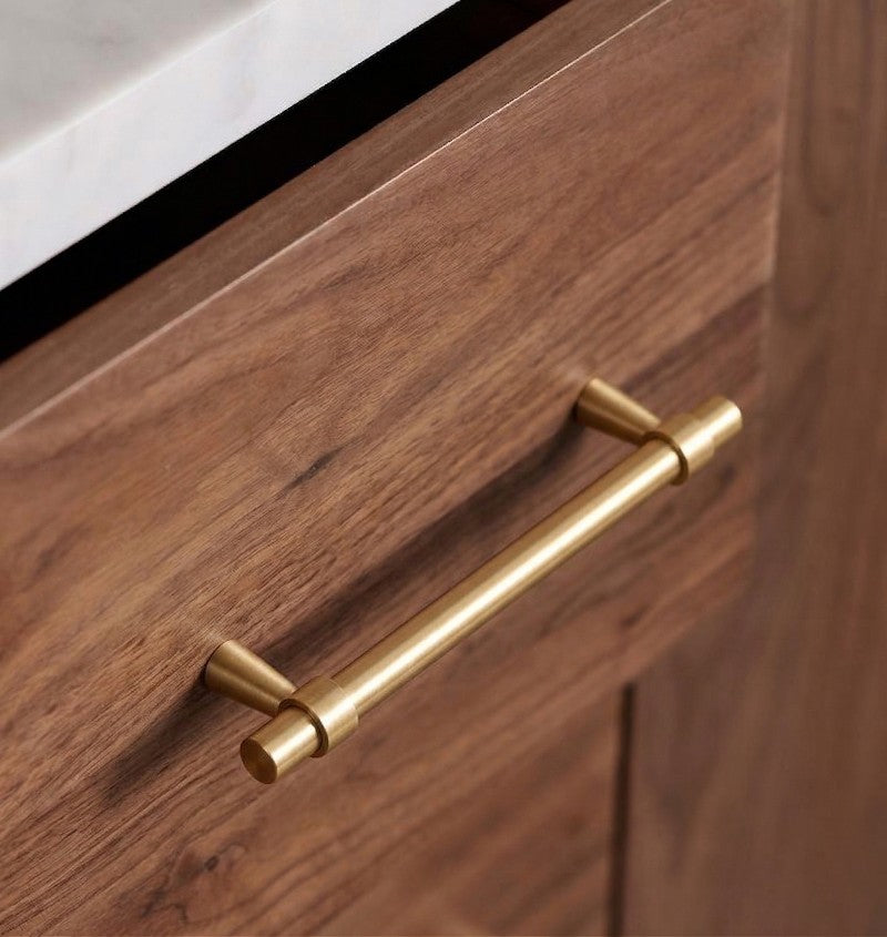 Hometouch handle crafted from brass with a gold finish, featuring a teardrop-shaped cabinet pull designed for furniture hardware applications, available at www.hometouchware.com.