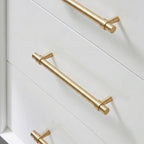 A brass cabinet pull in a teardrop shape with a gold finish, designed for furniture and cabinetry hardware applications, sourced from Hometouchware.