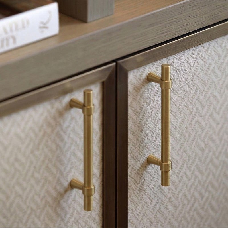 A teardrop-shaped cabinet pull in brass gold finish, designed for furniture hardware applications and available from Hometouch.