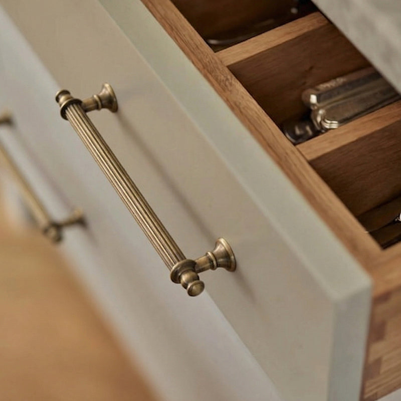 A teardrop-shaped cabinet pull in polished brass gold finish, designed for modern cabinetry and furniture hardware applications.