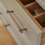 A teardrop-shaped cabinet pull in polished brass gold finish, designed for modern cabinetry and furniture hardware applications.