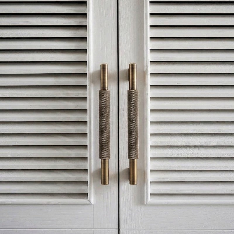 A teardrop-shaped brass cabinet pull in a warm gold finish, designed for furniture and cabinetry hardware with a sleek modern aesthetic suitable for interior design and home improvement projects.