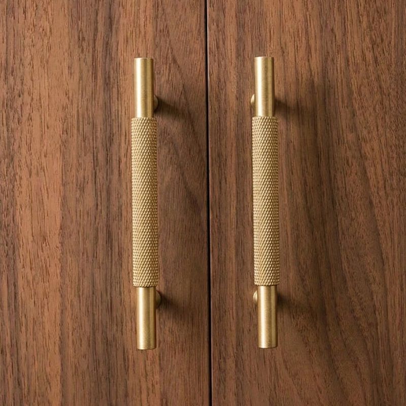 Hometouch's polished brass oval cabinet pull features a smooth metallic finish designed for contemporary cabinetry and furniture hardware applications.