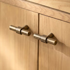 Hometouch's polished brass oval cabinet pull features a sleek profile suitable for contemporary kitchen or furniture hardware applications.