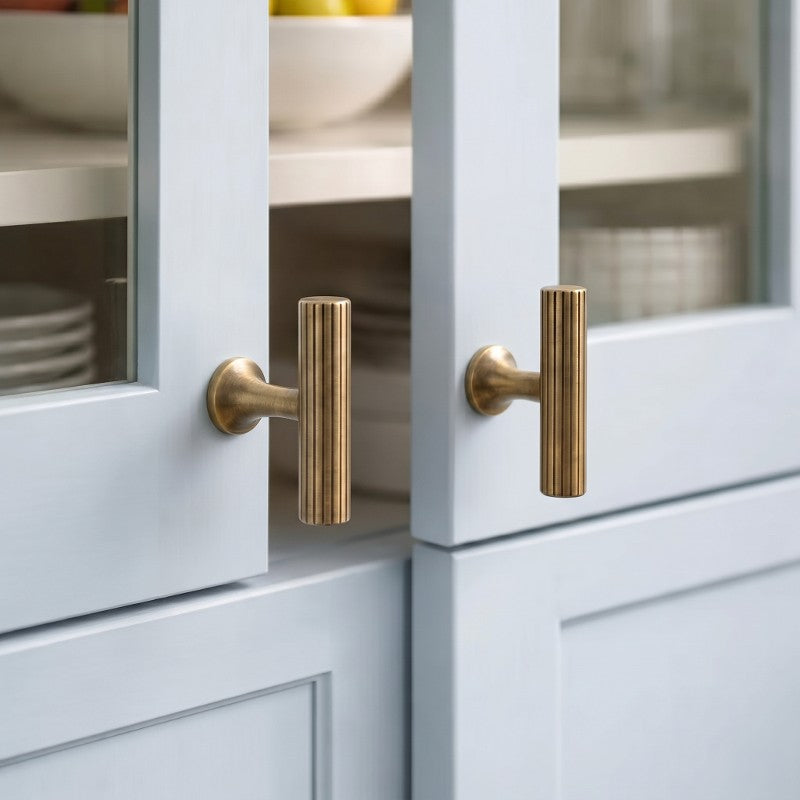 Hometouch curved lever cabinet handle features polished brass and satin gold finish options, designed for modern furniture applications requiring durable and elegant hardware solutions.