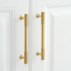 A solid brass cabinet pull with antique finish showcases a vertical knurled texture, designed for modern cabinetry hardware applications and available via www.hometouchware.com.