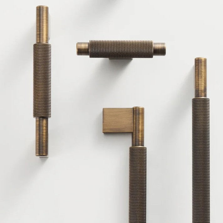A solid brass cross knurled T-bar pull and knob set for cabinet hardware, featuring a matte finish and geometric design suitable for modern kitchens or furniture.