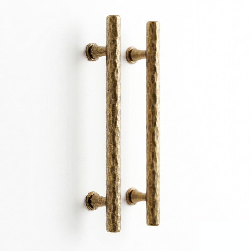 A product image of a Hometouch brass gold finish curved cabinet pull handle on a white background, showcasing the metallic luster and ergonomic shape for e-commerce use on hometouchware.com.