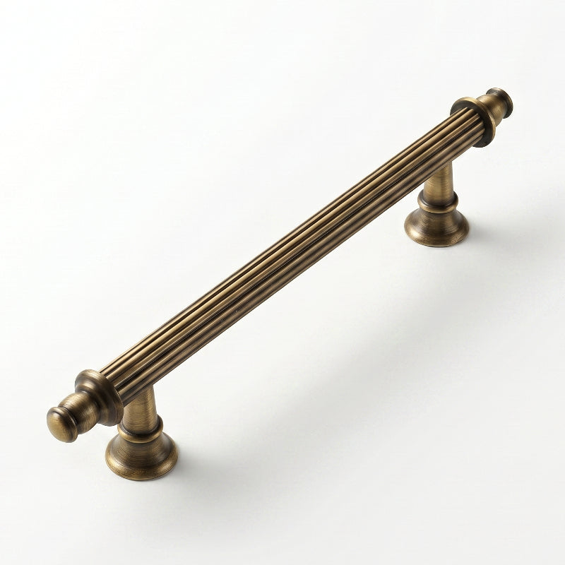 A Hometouch cabinet pull crafted in warm golden brass exhibits a curved profile ideal for modern kitchen and bathroom cabinetry hardware.