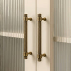 Hometouch antique brass bar cabinet pull features a bar-style shape in warm antique brass finish, presented as product photography for hardware specifications and available through www.hometouchware.com.