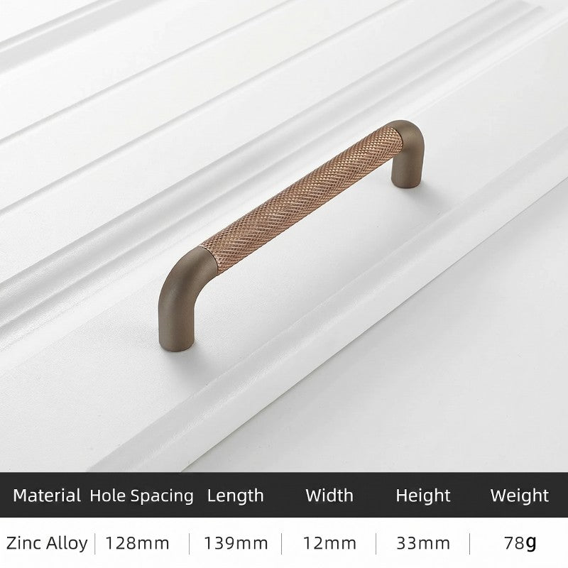 Hometouch curved lever cabinet pull features an antique gold finish over brass material in a smooth ergonomic shape, presented as product photography for furniture hardware applications in interior design or e-commerce contexts.