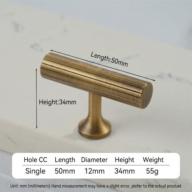 A curved cabinet pull from Hometouch features antique bronze-finished brass material, designed for modern cabinetry hardware applications with its smooth organic shape and warm metallic texture.