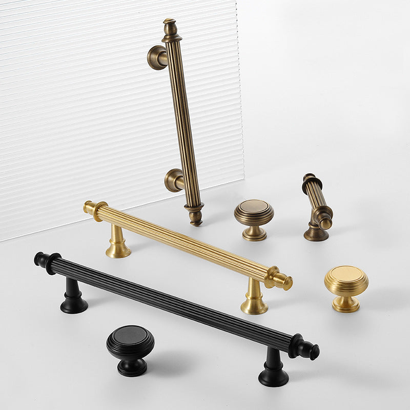 A rectangular drawer pull in a striped design, crafted from brass with a gold finish, serves as a cabinet or furniture handle for the Hometouch brand.
