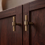 A contemporary rectangular cabinet pull featuring a matte brass finish by Hometouch, designed for modern cabinetry hardware applications with clean lines and functional elegance.