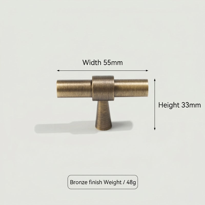 A curved brass cabinet pull from Hometouch features a warm-toned finish, designed specifically for bar cabinet hardware applications in residential and commercial interiors.