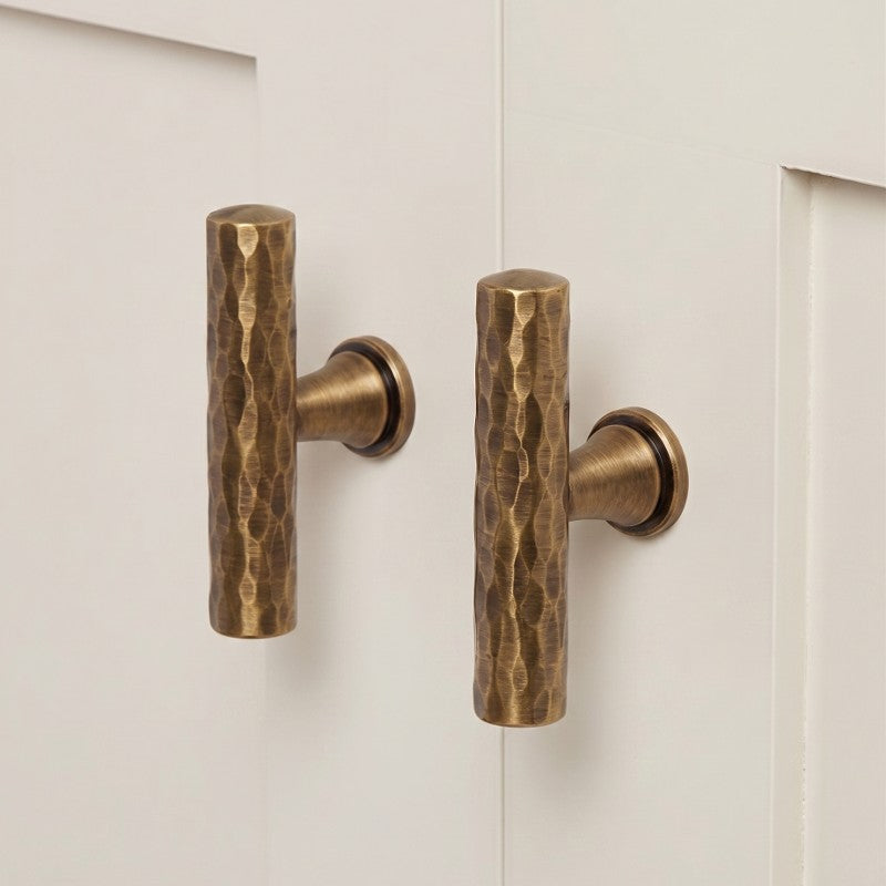 A Hometouch oval brass cabinet pull with warm bronze finish, suited for contemporary kitchen cabinetry and furniture hardware design.