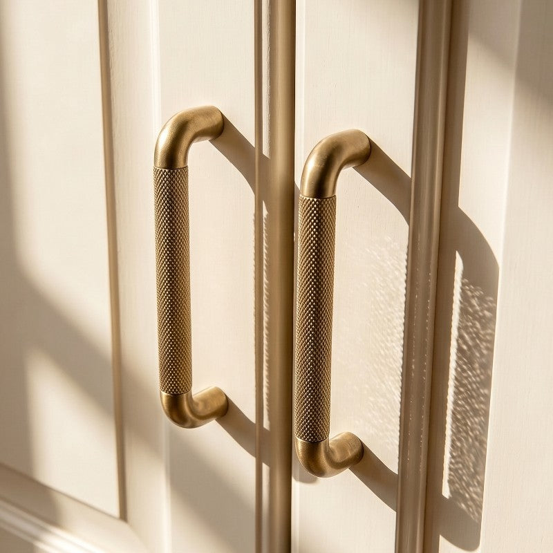 A Hometouch oval cabinet pull crafted from yellow brass is presented in clean product photography suitable for furniture hardware catalogs and interior design specifications.