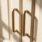 A Hometouch oval cabinet pull crafted from yellow brass is presented in clean product photography suitable for furniture hardware catalogs and interior design specifications.