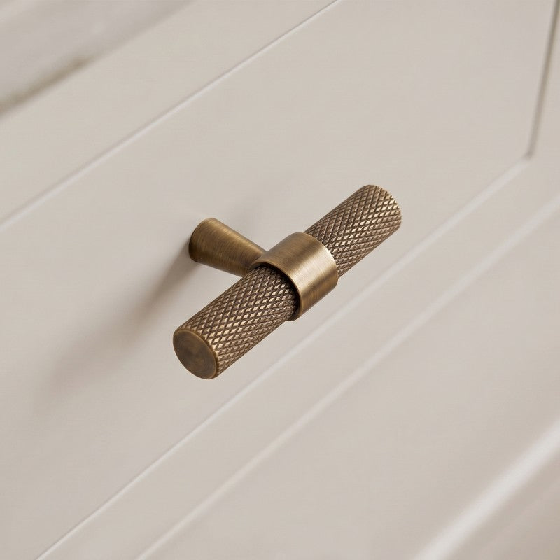 Hometouch hardware handle knobs in brass with a matte finish enhance modern kitchen cabinet designs. Discover this contemporary hardware solution at www.hometouchware.com.