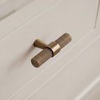Hometouch hardware handle knobs in brass with a matte finish enhance modern kitchen cabinet designs. Discover this contemporary hardware solution at www.hometouchware.com.