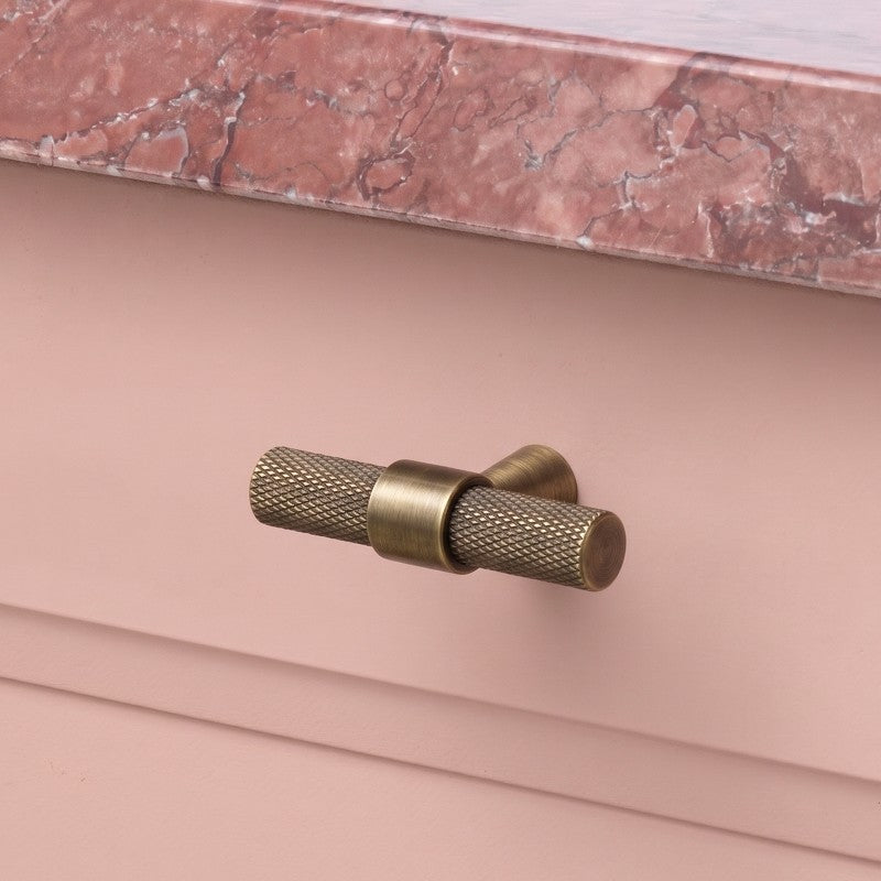 Hometouch hardware handle knobs in polished brass provide a minimalist modern accent for kitchen cabinet hardware, captured in clean product photography ideal for e-commerce presentation at www.hometouchware.com.