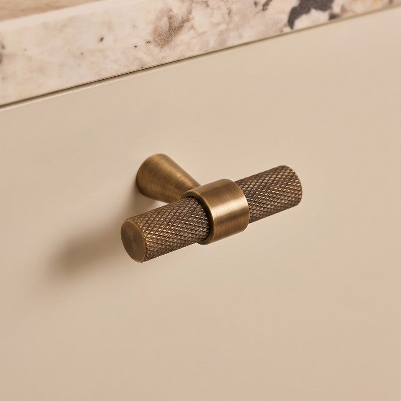 Hometouch hardware handle knobs crafted from solid brass feature a refined matte finish ideal for contemporary kitchen cabinet installations, presented in clean product-focused photography for e-commerce or interior design reference at www.hometouchware.com.