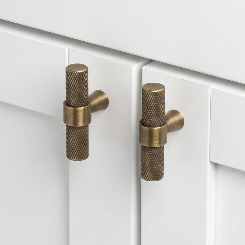 Hometouch hardware handle knobs in yellow brass showcase a matte finish and minimalist design tailored for modern kitchen cabinet applications, available at www.hometouchware.com.