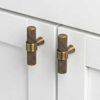 Hometouch hardware handle knobs in yellow brass showcase a matte finish and minimalist design tailored for modern kitchen cabinet applications, available at www.hometouchware.com.