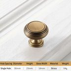 Textured antique brass drawer knob with concentric ring detailing, ideal for rustic or traditional wooden cabinets—by HomeTouch.