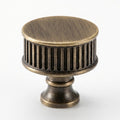 Textured ribbed cabinet knob in modern European style, sleek brushed brass finish for bathroom cabinets by HomeTouch