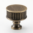 Textured ribbed cabinet knob in modern European style, sleek brushed brass finish for bathroom cabinets by HomeTouch