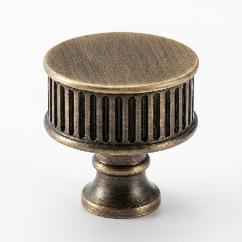 Textured ribbed cabinet knob in modern European style, sleek brushed brass finish for bathroom cabinets by HomeTouch