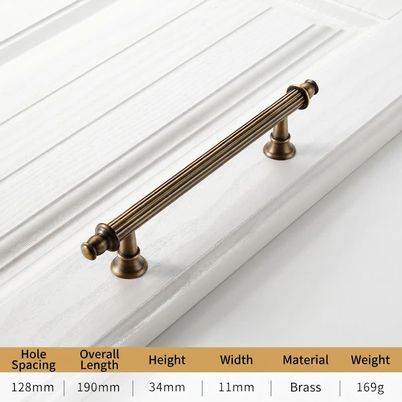 A textured, antique-style brass long bar pull for cabinet doors and drawers by HomeTouch, featuring a classic ribbed design and elegant vintage finish.