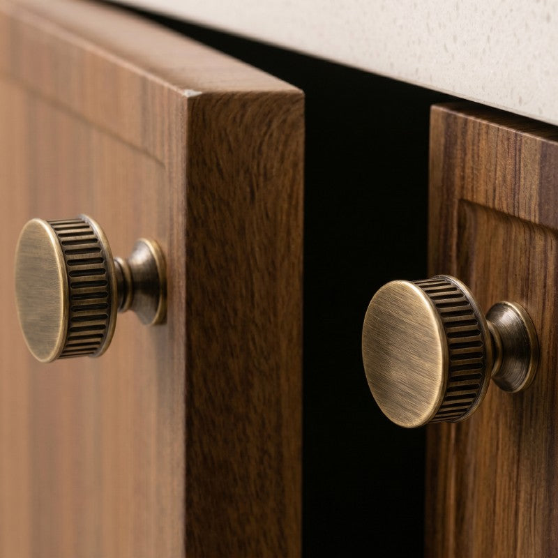 Textured minimalist cabinet knobs in Japandi style, sleek and modern, mounted on wooden drawers by HomeTouch.